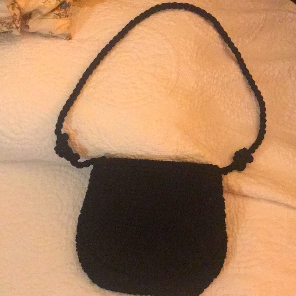 Navy blue crocheted handbag.